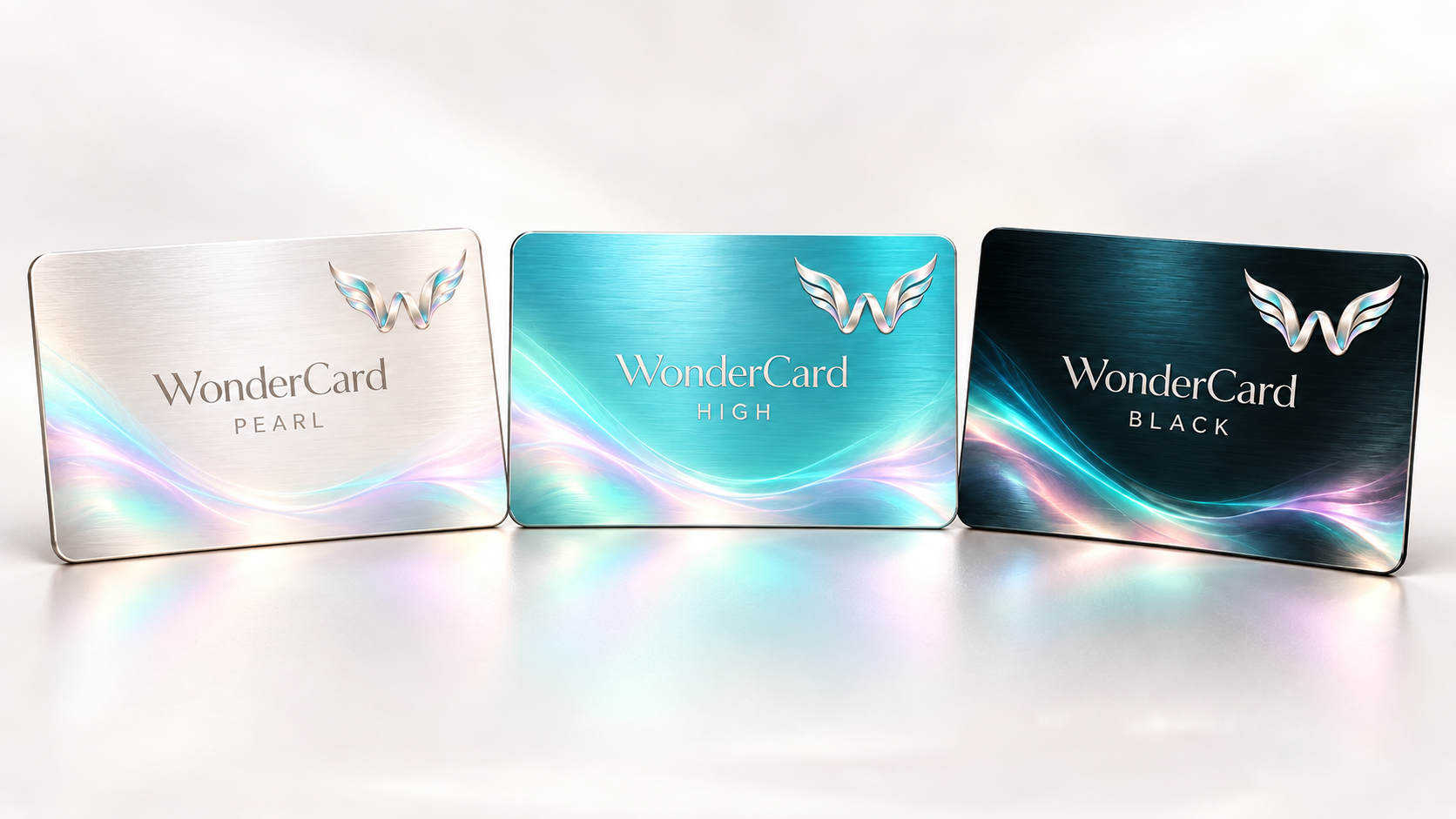 WonderCard Pearl in pearl silver, High in turquoise and Black in midnight teal, with matching winged W emblems.